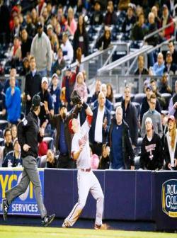 Be aware of the boundary fence and dugout.  Go to the fence, find it with your hand or glove, then come back to the ball.